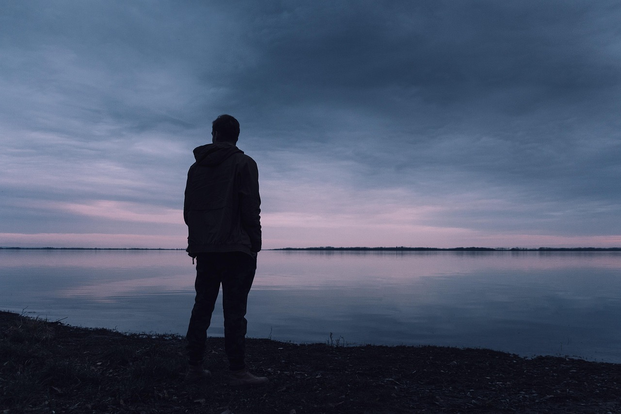 A solitary figure at dusk — the isolation many pilots feel when facing mental health challenges alone